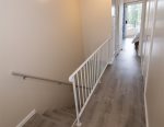 Hallway with washer/dryer.